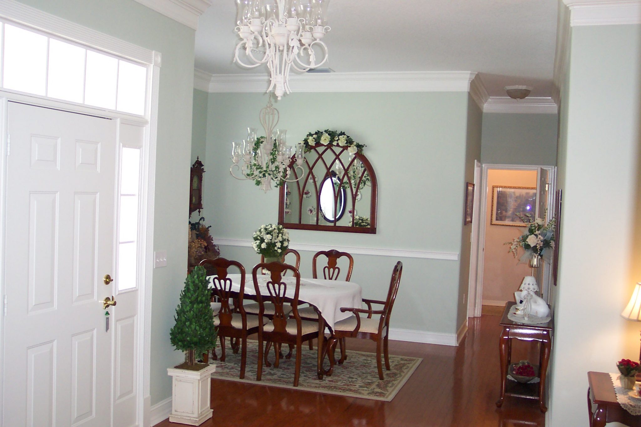 Picture of formal Windsor dining room.  Hallway on right leads to kitchen and upstairs studio.